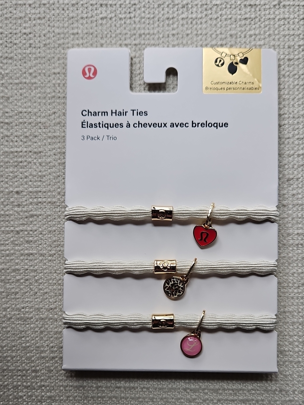 lululemon athletica Charm Hair Ties Trio — White Bands with Red & Pink Charms